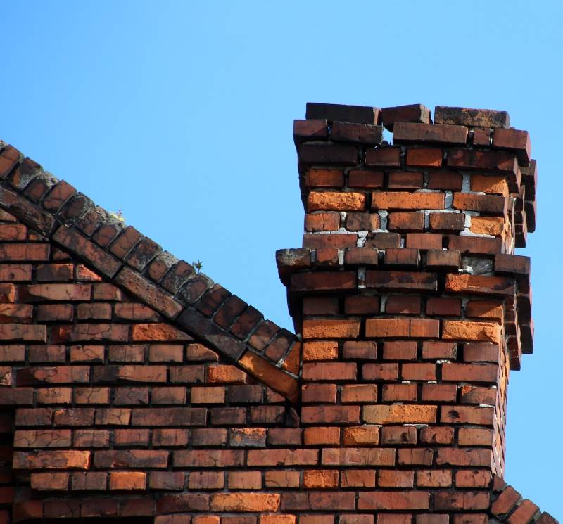 Signs Your Midlothian Home Needs a Chimney Inspection Damaged chimney on an Midlothian home showing cracks and missing mortar